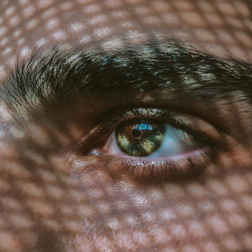 A person looking into the distance with a clear and focused gaze.